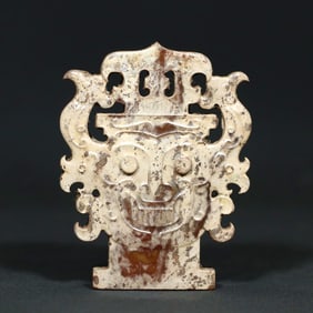 A HETIAN JADE 'HUMAN FACE AND PHOENIX'PENANT