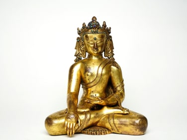 A GILT BRONZE FIGURE OF SEATED SAKYAMUNI