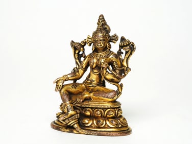 A GILT BRONZE FIGURE OF TARA
