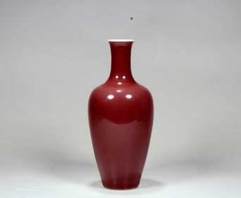 A RED GLAZED GUANYIN VASE