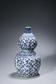 A Blue and White 'Floral Scroll' Gourd-Shaped Vase