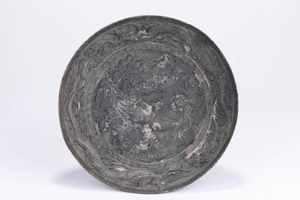 A Silver Carved 'Dragon and Phoenix' Dish