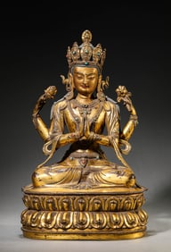 A Gilt-Bronze Four-Armed Guanyin