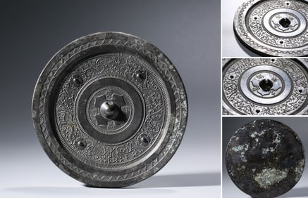 A Bronze 'Four-Nipple Birds and Beasts' Mirror