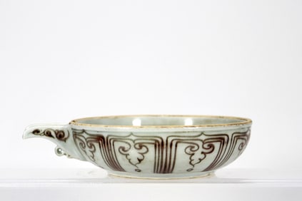 A RED GLAZED 'LOTUS'POURING VESSEL, YI