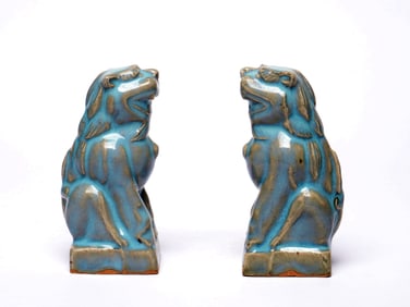 A PAIR OF JUNYAO CELADON LIONS