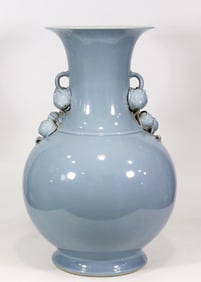 A CELADON 'PEACH'VASE WITH DOUBLE HANDLE