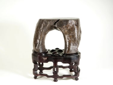 A TAIHU STONE INSCRIBED ORNAMENT