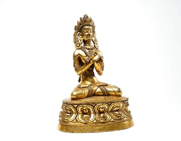 A GILT BRONZE FIGURE OF BUDDA