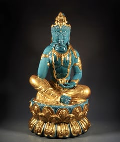 A TURQUOISE-GLAZED WITH GOLD FIGURE OF BUDDA