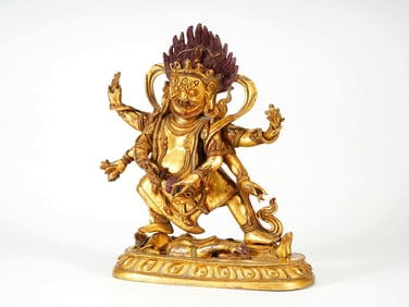 A GILT BRONZE FIGURE OF MAHAKALA