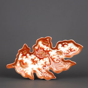 A RED GLAZED 'GOLD FISH'LEAF FORM BRUSH MOISTENER