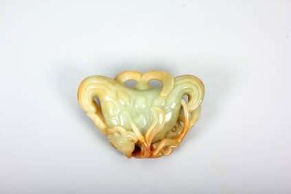 A HETIAN JADE 'WATER CALTROP' CARVING