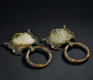 Pair of Bronze Gold and Silver Inlaid Jade Carved Beast Face Pattern Ornament