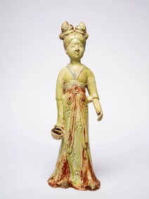 A SANCAI-GLAZED FEMALE TOMB FIGURINE