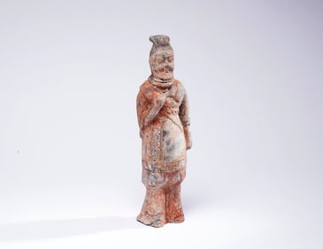 A POTTERY FIGURE