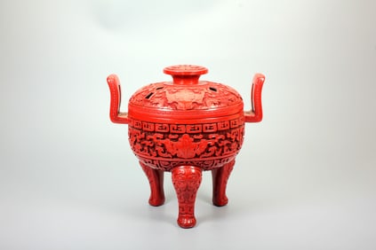 A CARVED CINNABAR LACQUER 'BEAST'TRIPOD CENSER