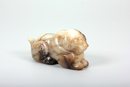 A HETIAN JADE CARVING OF AUSPICIOUS BEAST