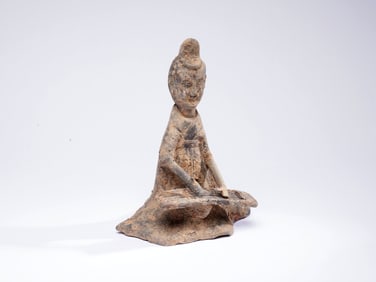 A FIGURE OF POTTERY MUSICIAN