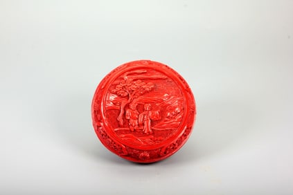 A CARVED CINNABAR LACQUER 'FIGURAL' BOX AND COVER