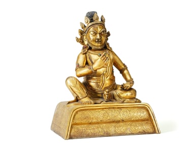 A GILT BRONZE FIGURE OF JAMBHALA