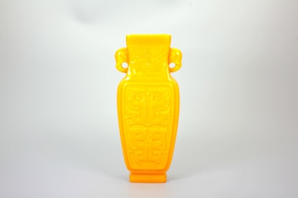 A YELLOW-OPAQUE-GLASS 'BEAST MASK AND PHOENIX' VASE WITH ELEPHANT HANDLES, JIAQING MARK