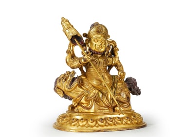 A GILT BRONZE FIGURE OF Virudhaka