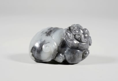 A BLUE-AND-WHITE JADE AUSPICIOUS BEAST