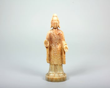 A HETIAN JADE STANDING FIGURE OF SHAKYAMUNI BUDDHA