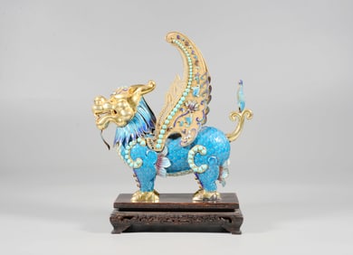 A SILVER ENAMELED AUSPICIOUS BEAST