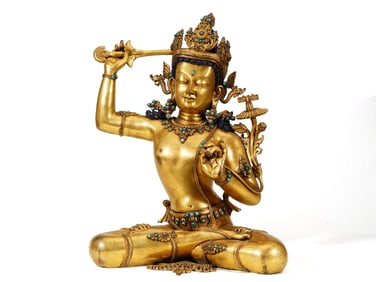 A GILT-BRONZE FIGURE OF BUDDA