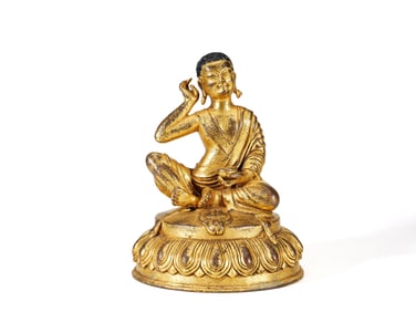 A GILT-BRONZE FIGURE OF BUDDA
