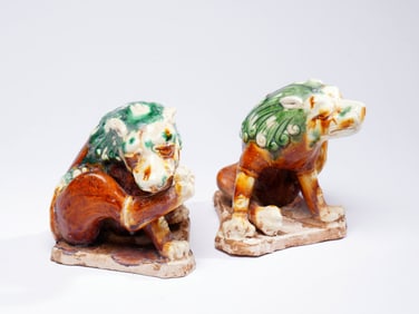 A PAIR OF SANCAI-GLAZED LION FIGURES