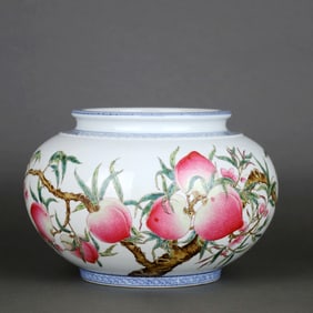 A TIWEI DIAN ZHI MADE BLUE-EDGED FAMILLE ROSE "NINE PEACHES" POMEGRANATE-FORM JAR