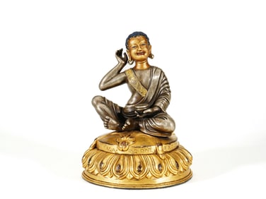 A GILT-BRONZE FIGURE OF BUDDA
