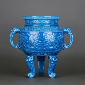 A PEACOCK-BLUE-GLAZED TRIPOD CENSER CARVED WITH BEAST-MASK PATTERN