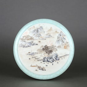 A CELADON-GLAZED LIDDED BOX WITH PANELED FAMILLE ROSE LANDSCAPE DESIGN