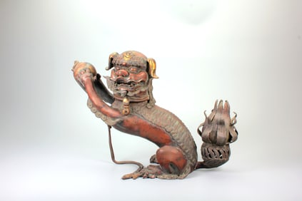A GILT BRONZE LION-PLAYING-WITH-BALL INCENSE BURNER