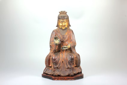 A GILT-BRONZE DAOIST DEITY FIGURE