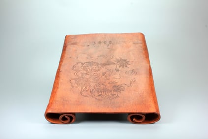 A CINNAMON-WOOD SCROLL TABLE CARVED WITH LION PLAYING WITH EMBROIDERED BALL