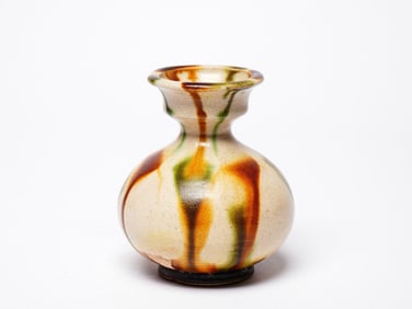 A SANCAI-GLAZED DISC-MOUTHED VASE