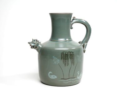 A GORYO CELADON BEAST-HEADED EWER
