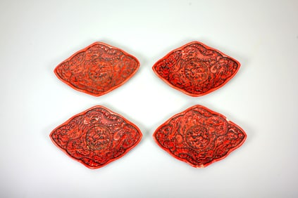 A SET OF CARVED CINNABAR LACQUER PLATES