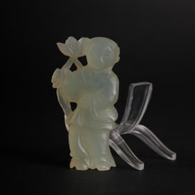 A LOTUS-HOLDING CHILD FIGURE