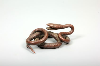 A BRONZE SERPENT SCULPTURE