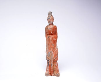 A POTTERY FIGURE