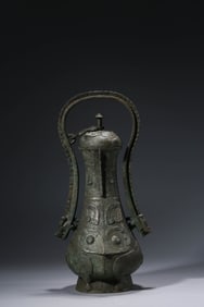 A Bronze 'Taotie' Ewer with Bone Handle