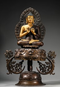 A Lacquered and Gilt Bronze Vairochana