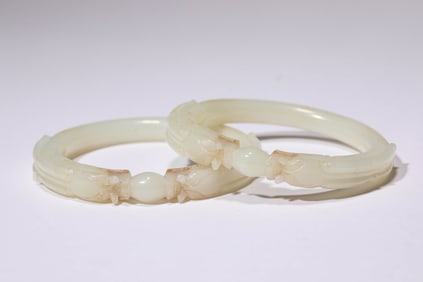 A Group of Jade Carved 'Chilong' Bracelets