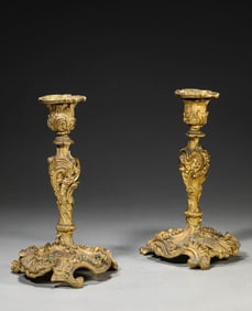 A Set Of Bronze Candlesticks